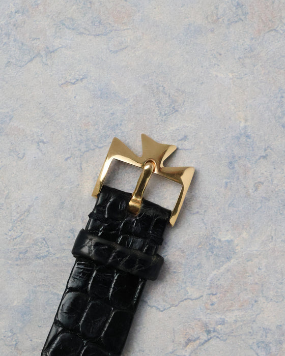 Original yellow gold Vacheron Constantin buckle attached to the black leather strap.