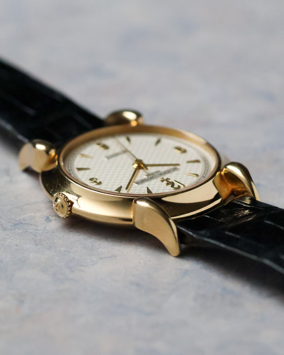 Angled dial view of the Vacheron Constantin Historiques 48003 displaying the guilloché dial and polished yellow gold case.