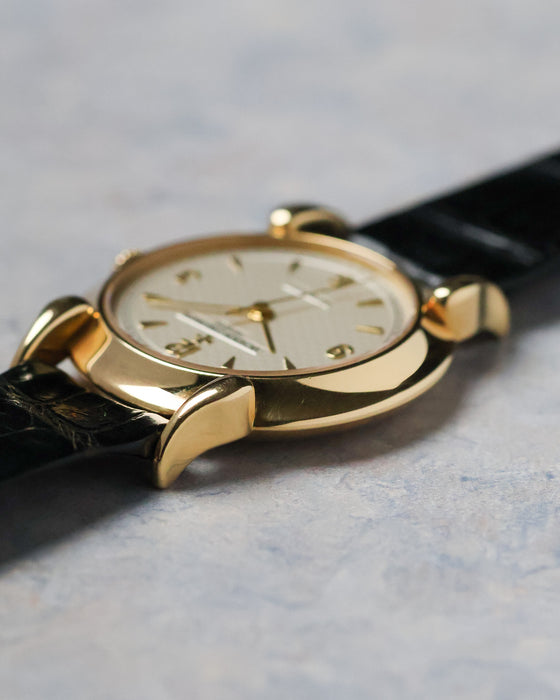 Side profile of the Vacheron Constantin Historiques 48003 showing the polished yellow gold case and sculpted teardrop lug.