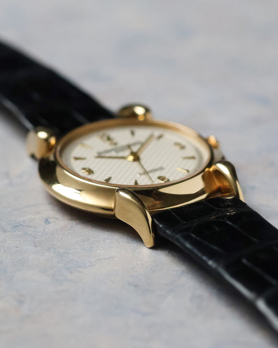 Angled view of the Vacheron Constantin Historiques 48003 highlighting the yellow gold case and curved lug design.