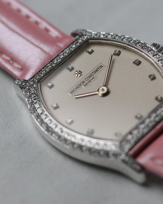 Close-up of the guilloché dial with factory diamond hour markers.
