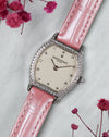 Full three-quarter composition of the Vacheron Constantin Ref. 10550 with its factory diamond-set case, guilloché dial and pink leather strap.
