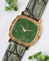 Angled front view of the Piaget Reference 12427 with its natural jade dial and Clous de Paris bezel.