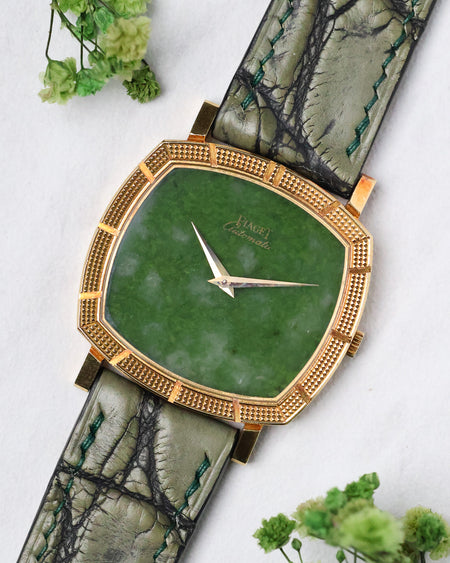 Angled front view of the Piaget Reference 12427 with its natural jade dial and Clous de Paris bezel.