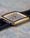 Macro side profile of the Piaget Protocole Jumbo Ref. 90154 showing the ribbed 18k yellow gold bezel and slim case.