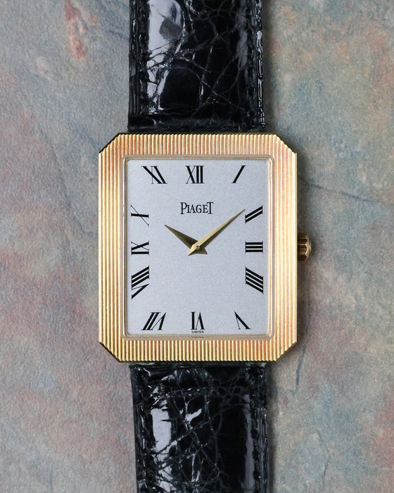 Front view of the Piaget Protocole Jumbo Ref. 90154 with silver dial, Roman numerals and 18k yellow gold case.