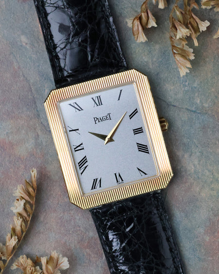 Angled front view of the Piaget Protocole Jumbo Ref. 90154 highlighting the silver dial, Roman numerals and ribbed bezel.