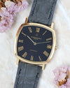 Angled front view of the Vacheron Constantin Ref. 7390 highlighting its black dial and slim yellow gold case.