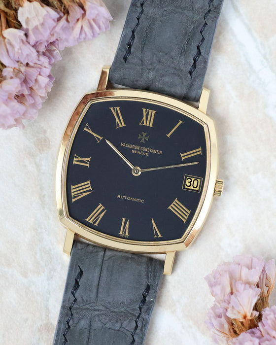 Angled front view of the Vacheron Constantin Ref. 7390 highlighting its black dial and slim yellow gold case.