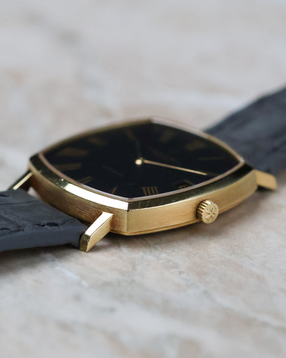 Side profile of the Vacheron Constantin Ref. 7390 displaying its slim 18K yellow gold case and signed crown.