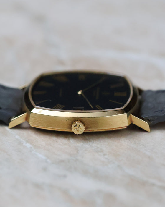 Low front profile of the Vacheron Constantin Ref. 7390 showing the thin case and black dial.