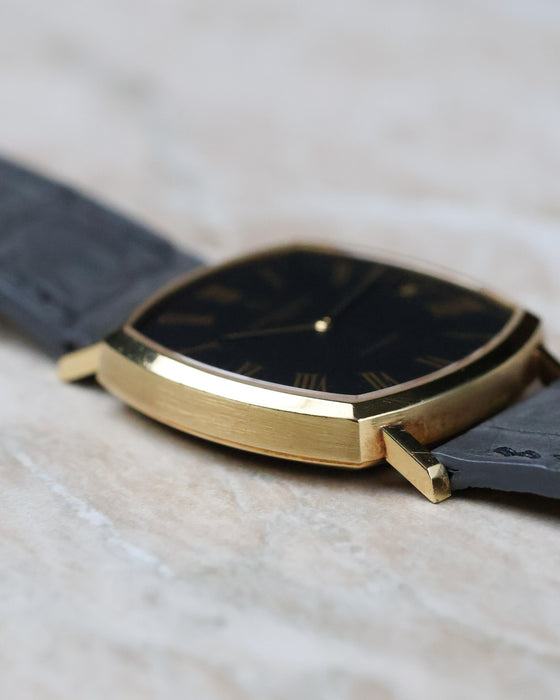 Opposite side profile of the Vacheron Constantin Ref. 7390 emphasizing the brushed 18K yellow gold case and floating lugs.