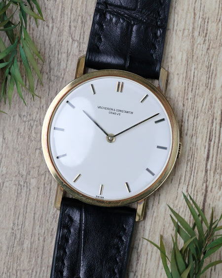 Vacheron Constantin Ref. 7811 with white dial, applied baton markers and black leather strap.
