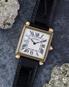Angled front view of the Cartier Tank Obus Ref. 1630 highlighting the black enamel bezel and square case.