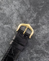 Original Cartier 18K yellow gold pin buckle fitted to the black leather strap.
