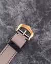 Reverse view of the original Cartier 18K yellow gold buckle with hallmarks visible.
