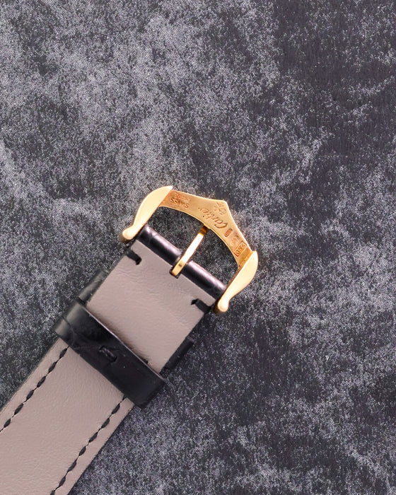 Reverse view of the original Cartier 18K yellow gold buckle with hallmarks visible.