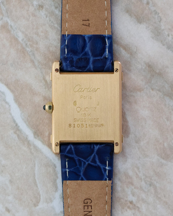 Caseback of the Cartier Tank Chinoise Ref. 81051 in 18K yellow gold with Cartier engravings and brushed finish.