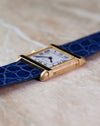Side profile of the Cartier Tank Chinoise Ref. 81051 showing the brushed gold case and polished horizontal bars.