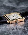Side profile of the Cartier Tank Obus Ref. 1630 highlighting the diamond cabochon crown and enamel bezel.