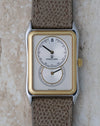 Front view of the Universal Genève Jump Hour Regulator Ref. 225.125 with a silver regulator dial, steel case and 18k gold bezel.