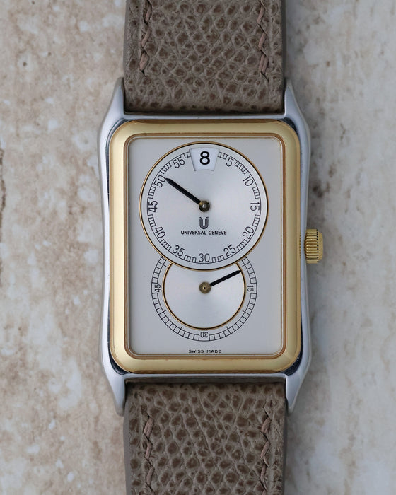 Front view of the Universal Genève Jump Hour Regulator Ref. 225.125 with a silver regulator dial, steel case and 18k gold bezel.