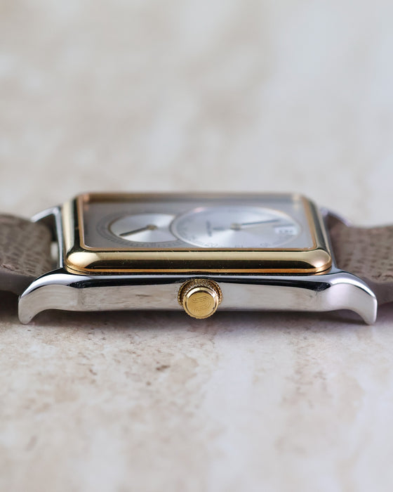 Crown-side profile of the Universal Genève Jump Hour Regulator Ref. 225.125 showing the signed crown and slim case construction.
