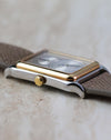 Angled side profile of the Universal Genève Jump Hour Regulator Ref. 225.125 highlighting the curved lugs and gold bezel.