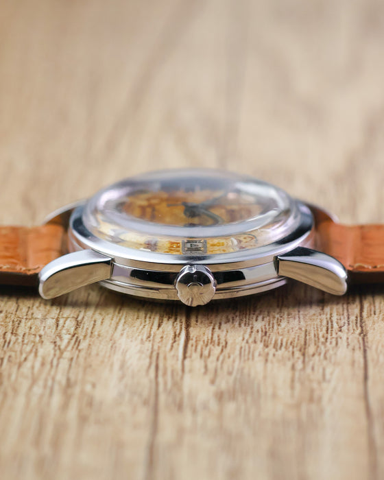 Front side profile of the Omega Seamaster Calendar Ref. 2849 showing the signed crown, polished case and domed acrylic crystal.