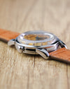 Side profile of the Omega Seamaster Calendar Ref. 2849 showing its domed crystal, polished stainless steel case and lyre-style lugs.