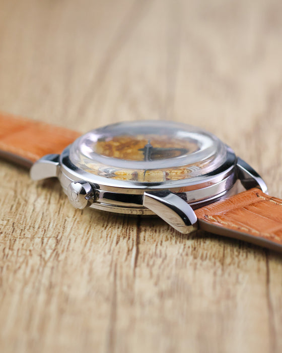 Side profile of the Omega Seamaster Calendar Ref. 2849 showing its domed crystal, polished stainless steel case and lyre-style lugs.