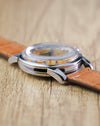 Angled side view of the Omega Seamaster Calendar Ref. 2849 with its polished lugs and high domed crystal.