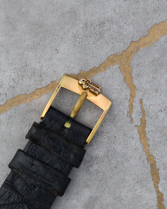 Original signed Corum gold-plated buckle with key motif.