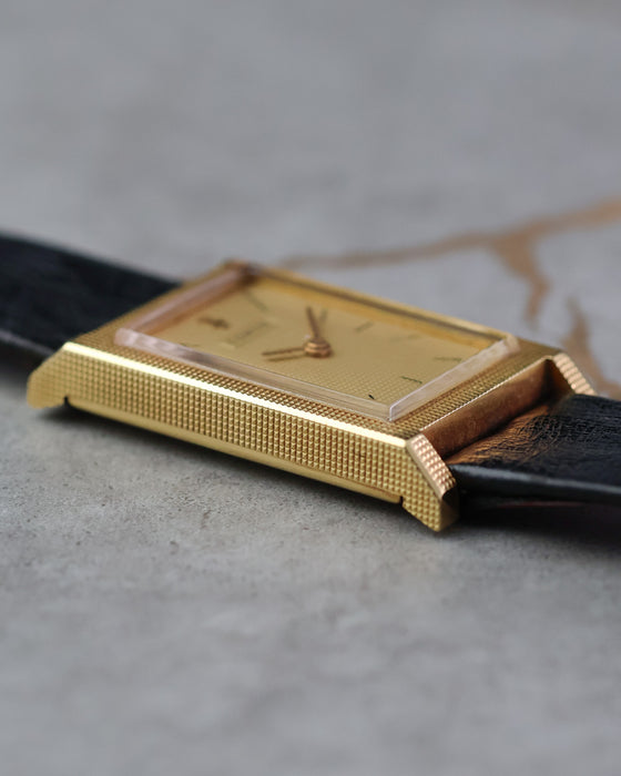 Low-angle view emphasizing the sharp case architecture.