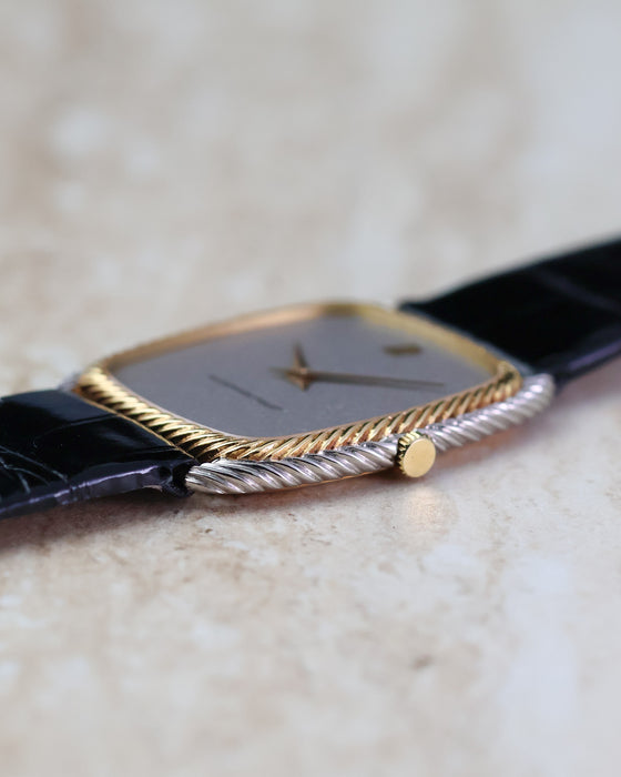 Side profile of the Audemars Piguet 4157CA showing its yellow and white gold rope case.