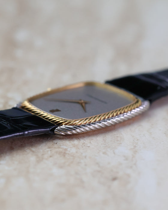 Close-up of the yellow gold inner rope bezel and contrasting white gold outer case.