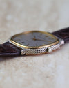 Side profile of vintage Audemars Piguet automatic showing the twisted white-gold rope case and yellow-gold bezel.