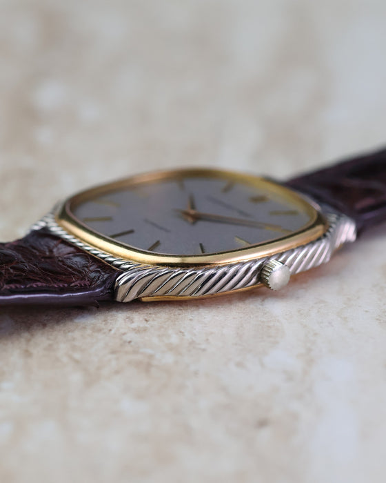 Side profile of vintage Audemars Piguet automatic showing the twisted white-gold rope case and yellow-gold bezel.