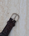 Matching white-gold rope-style pin buckle fitted to the dark brown leather strap.