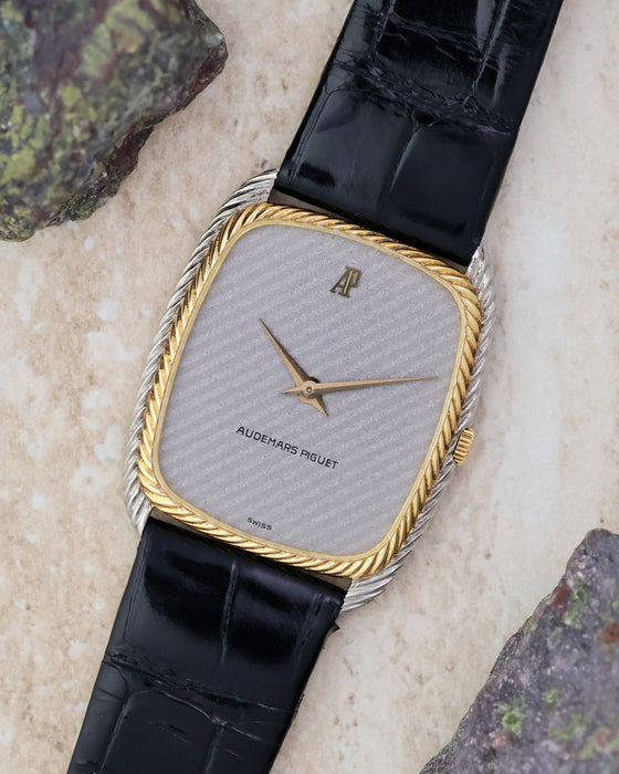 Angled front view highlighting the diagonal Snowflake dial texture and two-tone rope case.