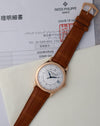 Patek Philippe Calatrava 5296R-001 displayed with its June 2025 Patek Philippe Japan service documentation.