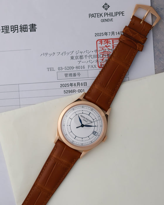 Patek Philippe Calatrava 5296R-001 displayed with its June 2025 Patek Philippe Japan service documentation.