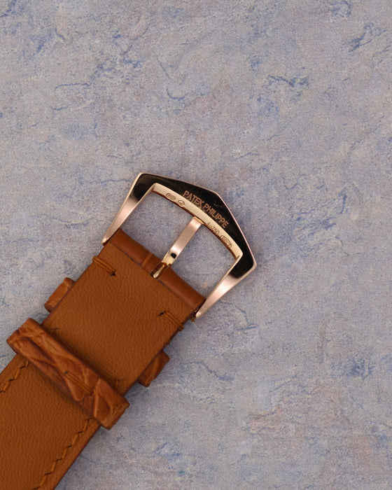 Signed Patek Philippe 18k rose gold buckle showing hallmarks and branding.