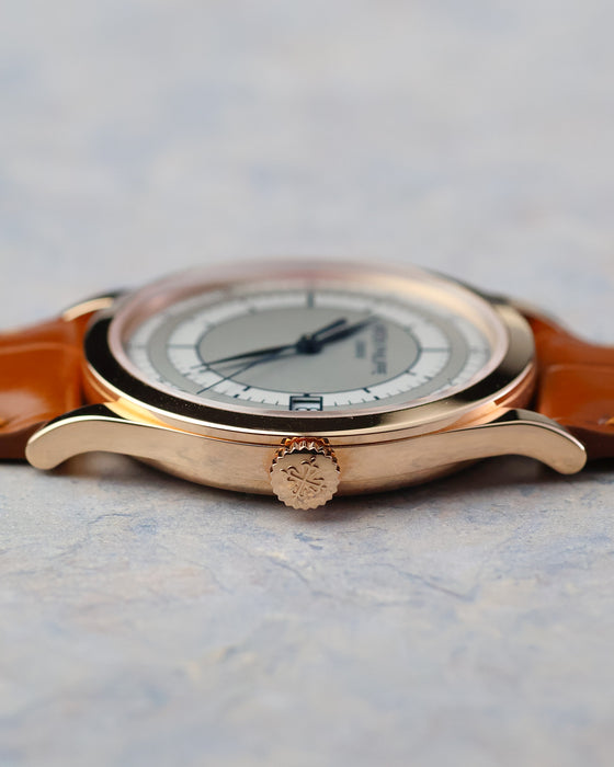 Crown-side profile showing the curved Calatrava case, lugs and signed Patek Philippe crown.
