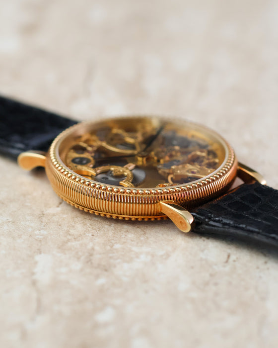 Angled profile showing the curved lugs and intricate case finishing.