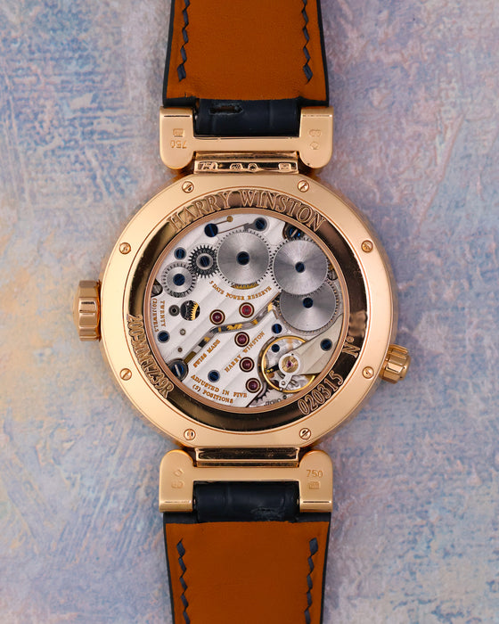Caseback of the Harry Winston Premier Excenter Time Zone 200-MMTZ39R showing its manual-winding calibre J7061 through the sapphire display back.