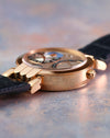 Side view highlighting the case construction and articulated lug design of the Premier Excenter Time Zone.