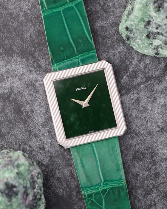 Angled view of the Piaget Protocole 9154 showing its natural jade dial and finely striped white gold bezel.
