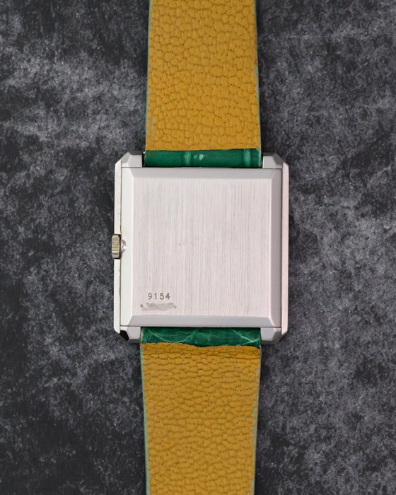Caseback of the Piaget Protocole Ref. 9154 showing the reference engraving and brushed white gold finish.