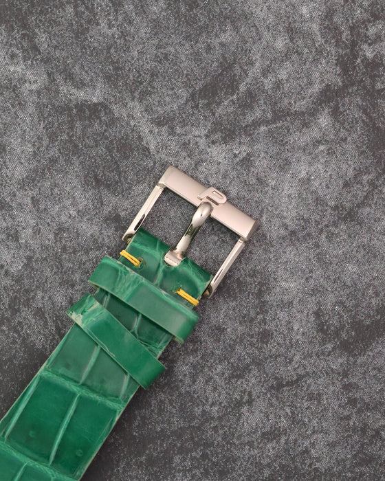 Signed Piaget buckle fitted to the green leather strap of the Protocole 9154.